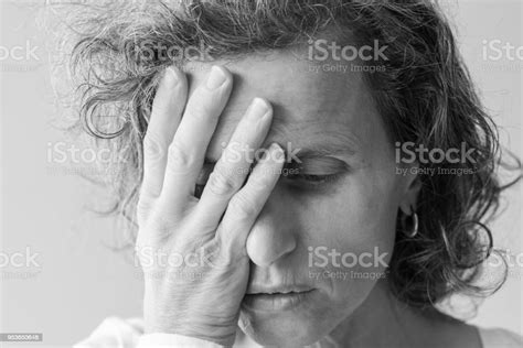 Middle Aged Woman With Hand Over Face Stock Photo Download Image Now