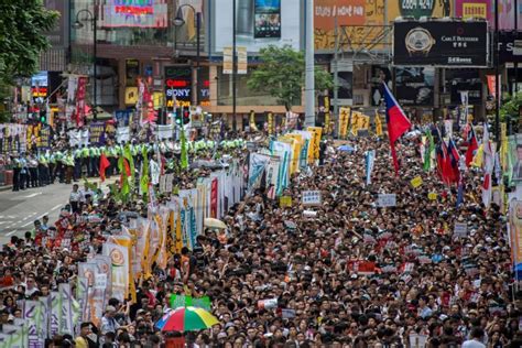 Protesters March In Hong Kong Financial Tribune