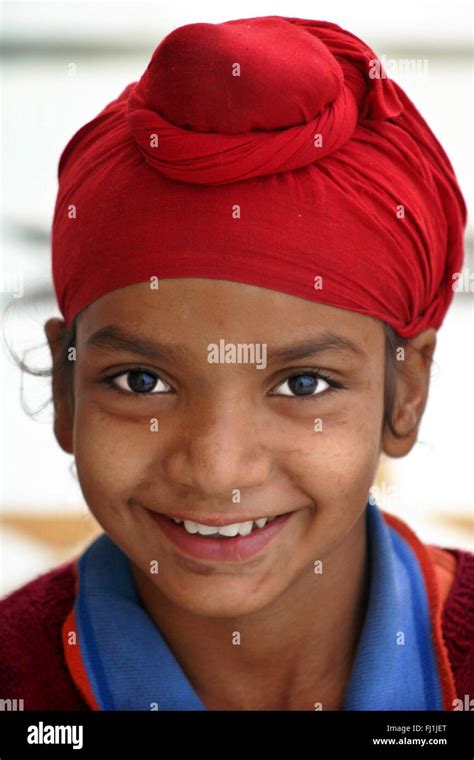 Punjabi Sikh Kid Child Boy Wearing Red Turban In Amritsar India Stock