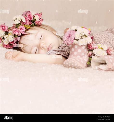 Cute Baby Girl Sleep With Flowers On Vintage Background Stock Photo Alamy