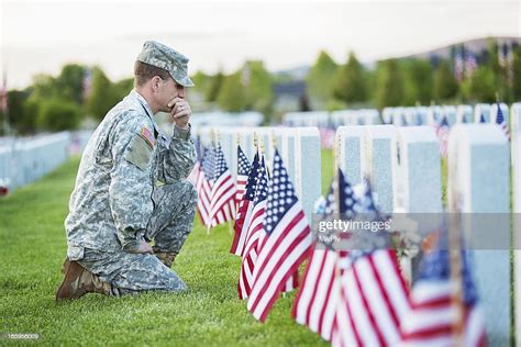 Soldier Kneeling At Grave High Res Stock Photo Getty Images