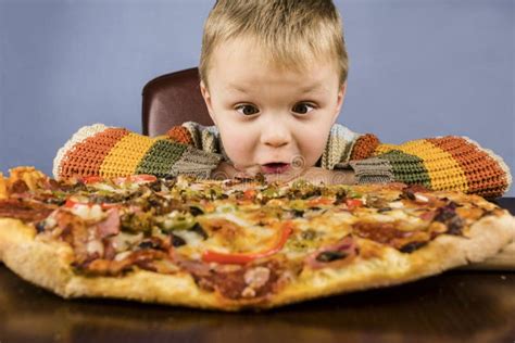 Boy Eating Pizza Stock Image Image Of Knife Pizza Table 65820237