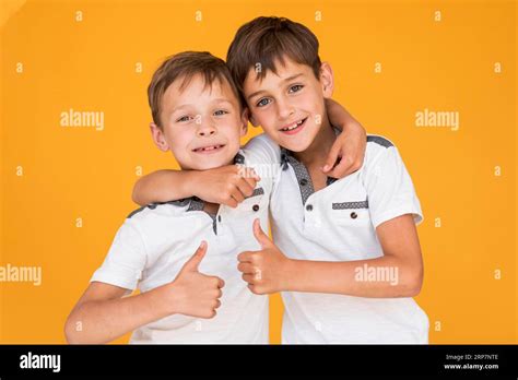 Little Brothers Holding Each Other Stock Photo Alamy