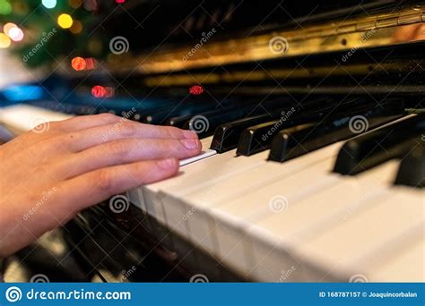 Child Playing A Song At The Piano Closeup Of His Hands Stock Image