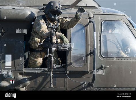 A Doorgunner Leaves A Us Blackhawk Helicopter In Masar I Sharif