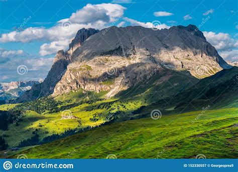 Landscape Of Dolomites With Green Meadows Blue Sky White Clouds And
