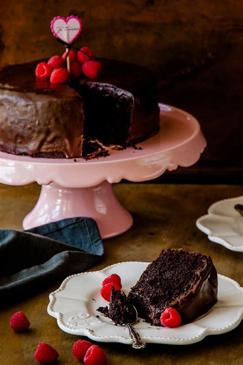 This beautifully moist chocolate cake is rich and decadent, with a sprinkling of chocolate chunks throughout and a velvety chocolate fudge frosting that melts in the mouth. Vegan chocolate cake recipe...the BEST EASY one bowl cake ...