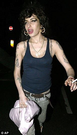 Singer amy winehouse has a drink between songs at the virgin festival at pimlico race course, in baltimore, maryland august 4, 2007. Amy Winehouse found dead at her London flat after 'drug ...