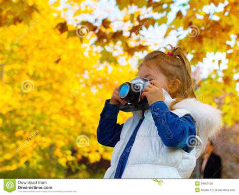 Little Girl Taking Picture Using Vintage Film Camera Royalty Free Stock