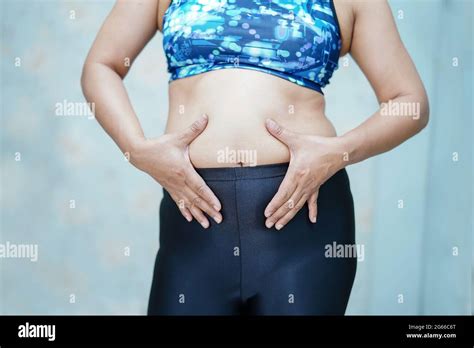 Overweight Asian Woman Show Fat Belly At Office Stock Photo Alamy