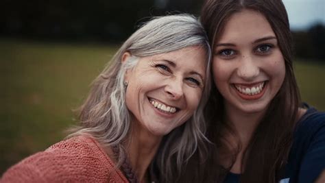 Mother And Daughter Pose Together For A Selfie Stock