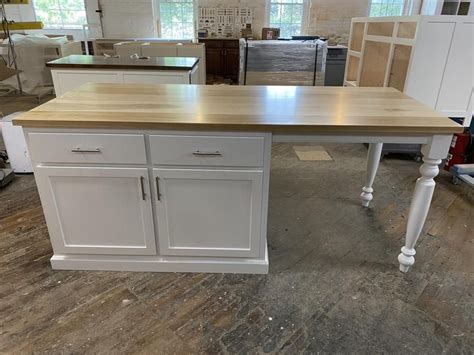 When you think island, you might picture a bank of cabinets topped with granite and dropped into the center of your kitchen. Item E4884 Kitchen Island with Seating and Turned Legs ...