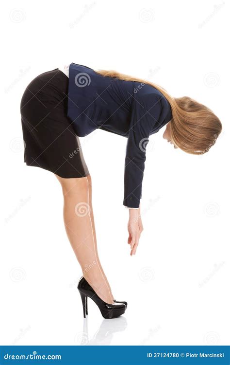 Young Business Woman Bending Down And Looking Royalty Free Stock
