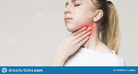 Woman Suffering From Sore Throat Touching Her Neck Stock Photo Image