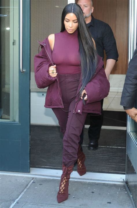 kim kardashian goes braless sports head to toe burgundy at kanye west s yeezy season 5 fashion