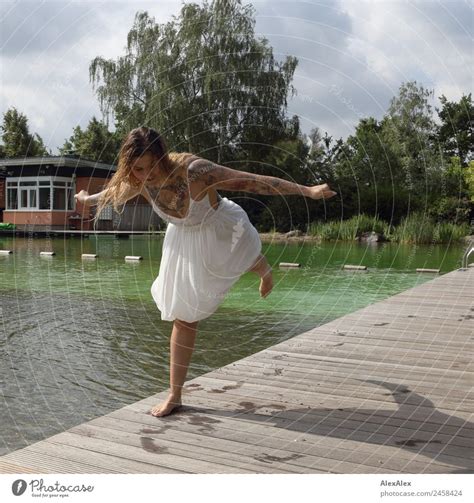 Woman Balancing At The Swimming Pool A Royalty Free Stock Photo From