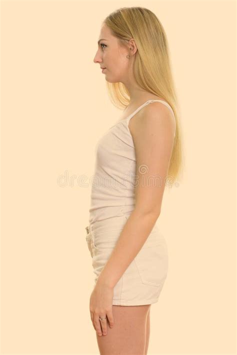 Profile View Of Young Beautiful Teenage Girl Standing Stock Photo