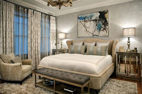 Serene Master Bedroom Features Upholstered Bed And Mirrored Nightstands