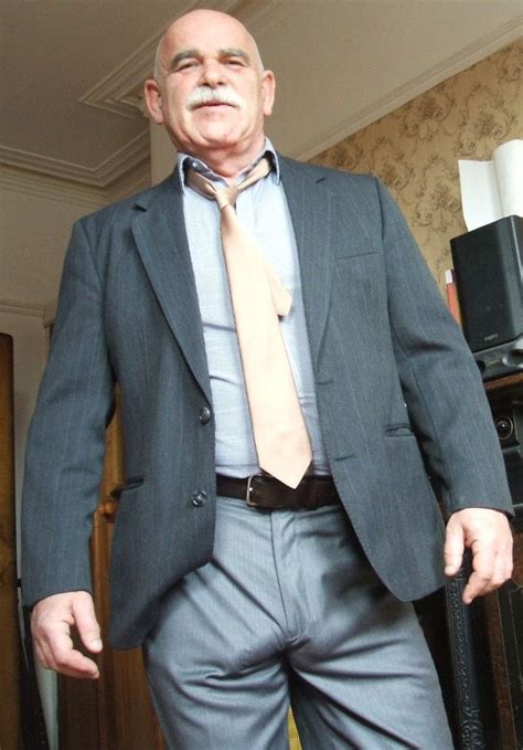 elegant senior man in suit and tie
