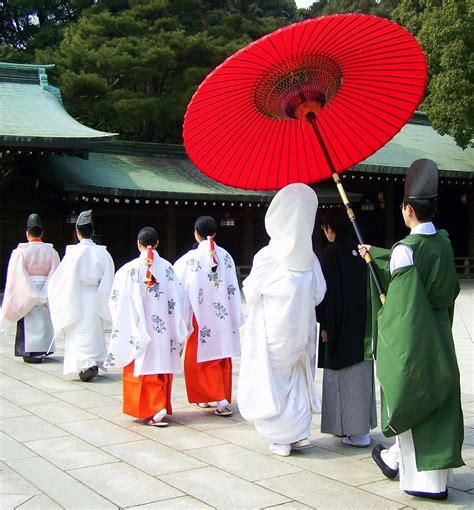 shinto wedding traditional japanese wedding japan priests mikos bride and groom back view