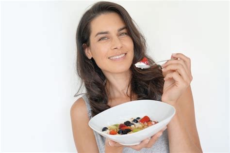 Premium Photo Portrait Of Attractive Brunette Woman Eating Healthy