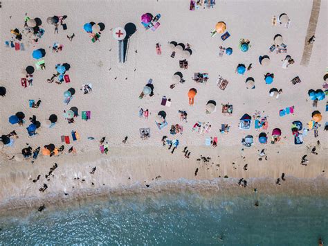 Drone View Of People At Beach Stock Photo