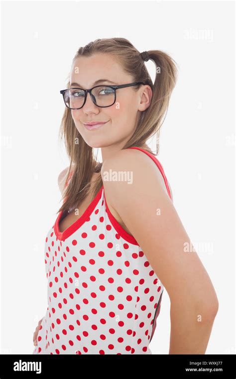 Portrait Of Young Woman In Ponytails Wearing Glasses Posing Over White