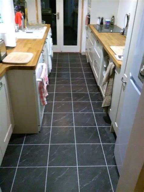 The sealer seemed to do the trick. Perfecto Flooring, Camaro Black Marble with Ice grouting strip | Flooring, Floor installation ...