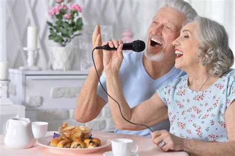 Premium Photo Senior Couple Husband And Wife Singing Songs