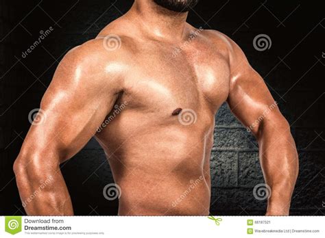 Composite Image Of Muscular Man Flexing His Biceps Stock Image Image