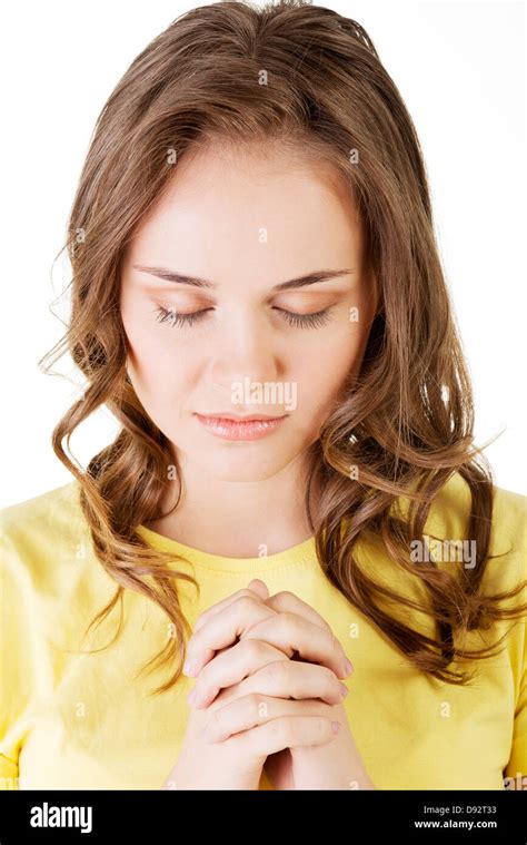 Young Pretty Caucasian Girl Praying Over White Background Stock Photo