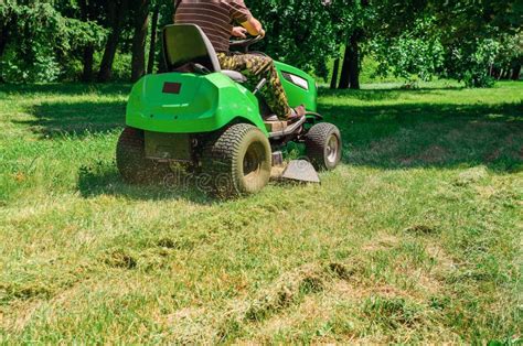 Lawn Mower In The Park Mowing The Grass Lawn Care Stock Photo Image