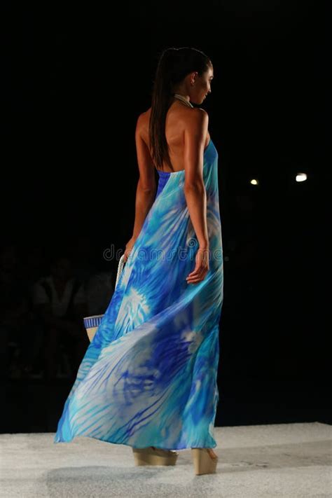 A Model Walks Runway In Designer Swim Apparel During The Caffe Swimwear