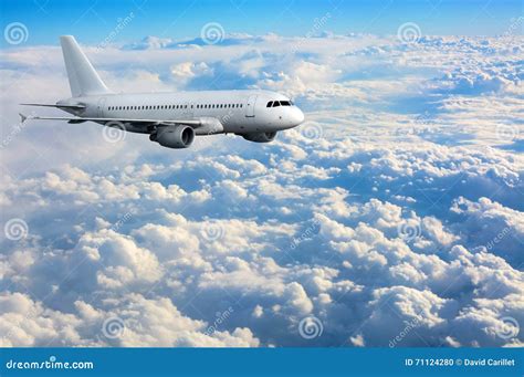 Commercial Passenger Plane Flying Above Clouds Stock Photo Image Of