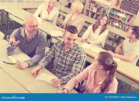 Adult Students Writing In Classroom Stock Image Image Of Adult