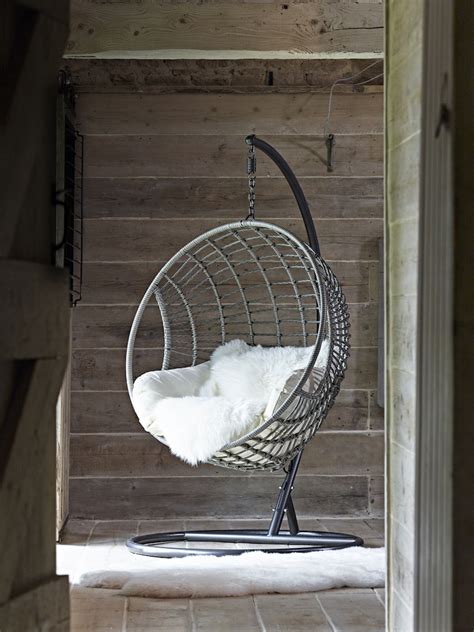 A hanging chair utilizes a single point of contact. How To Create A Beautiful Indoor Garden This Winter