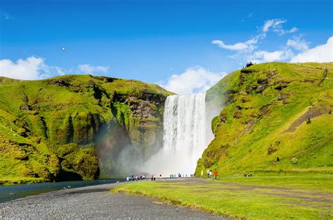 Skógafoss Waterfalls Below The Eyjafjöll Mountains And West Of