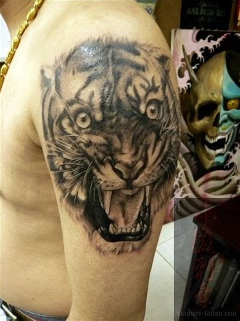 Cancer ribbon tattoo design on wrist. Free Tattoo Designs : Shouting tiger tattoo design