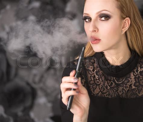 Elegant Woman Smoking E Cigarette Stock Image Colourbox
