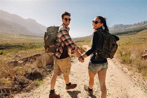 Beautiful Young Couple On Hiking Trail In Nature Reserve By Stocksy
