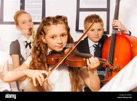 Group Of Kids Playing Musical Instruments Together Stock Photo Alamy