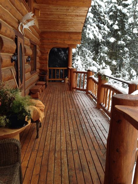 Covered Cabin Porch Makes The Porch A Wonderful Place To Watch The Snow