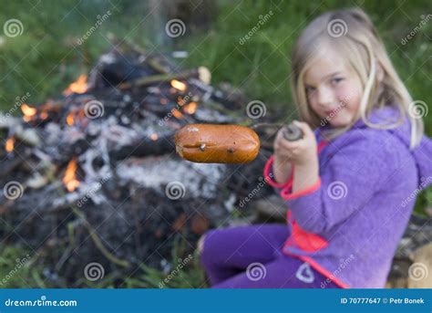Girl Eating Sausage Cooked On Camp Fire Stock Image Image Of Child