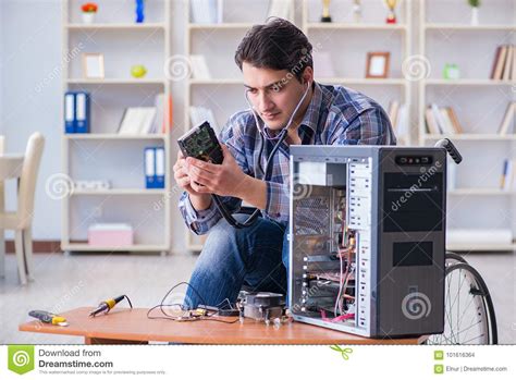 Wait for the process to finish scanning and fixing the disk errors. The Disabled Man On Wheelchair Repairing Computer Stock ...