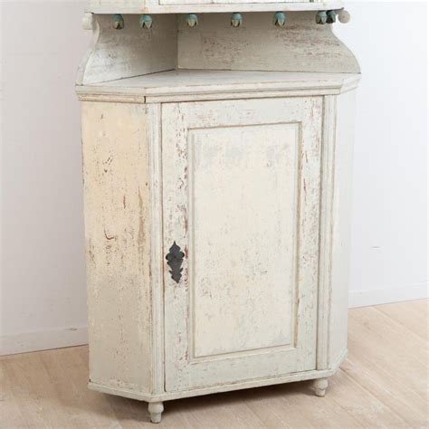 Two panelled doors open to 19th century swedish painted corner cabinet features a delightful patina on the background, plus. Late 18th Century Northern Swedish Gustavian Corner ...