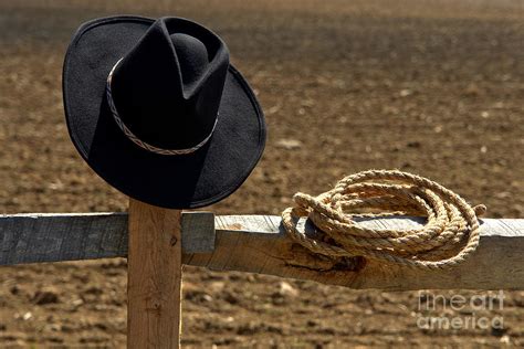 Cowboy Hat And Rope On Fence Photograph By Olivier Le Queinec
