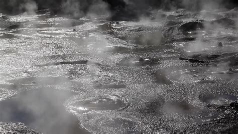 Geothermal mud pools at te puia. Boiling Mud Pool In New Zealand With Smoke And Bubbles ...
