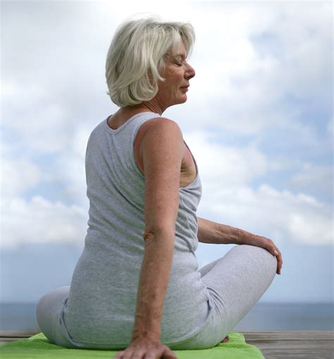 Senior Woman Doing Yoga Outdoors Aw Health Care