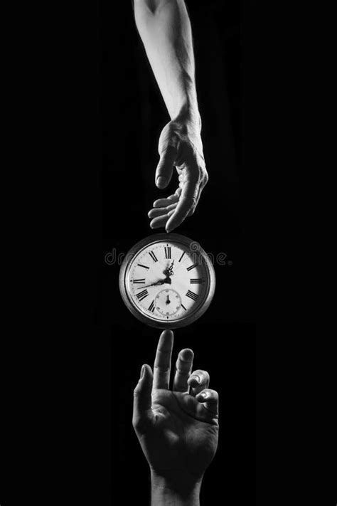 Touch Of Time Hands Touching A Clock With Numbers Stock Photo Image