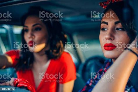 Beautiful Pinup Girls Driving In The Vintage Care And Putting Makeup